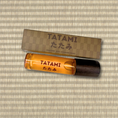 Load image into Gallery viewer, Tatami perfume bottle and packaging on a striped background