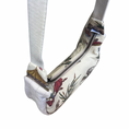 Load image into Gallery viewer, Floral-patterned sling bag with a zipper on a white background
