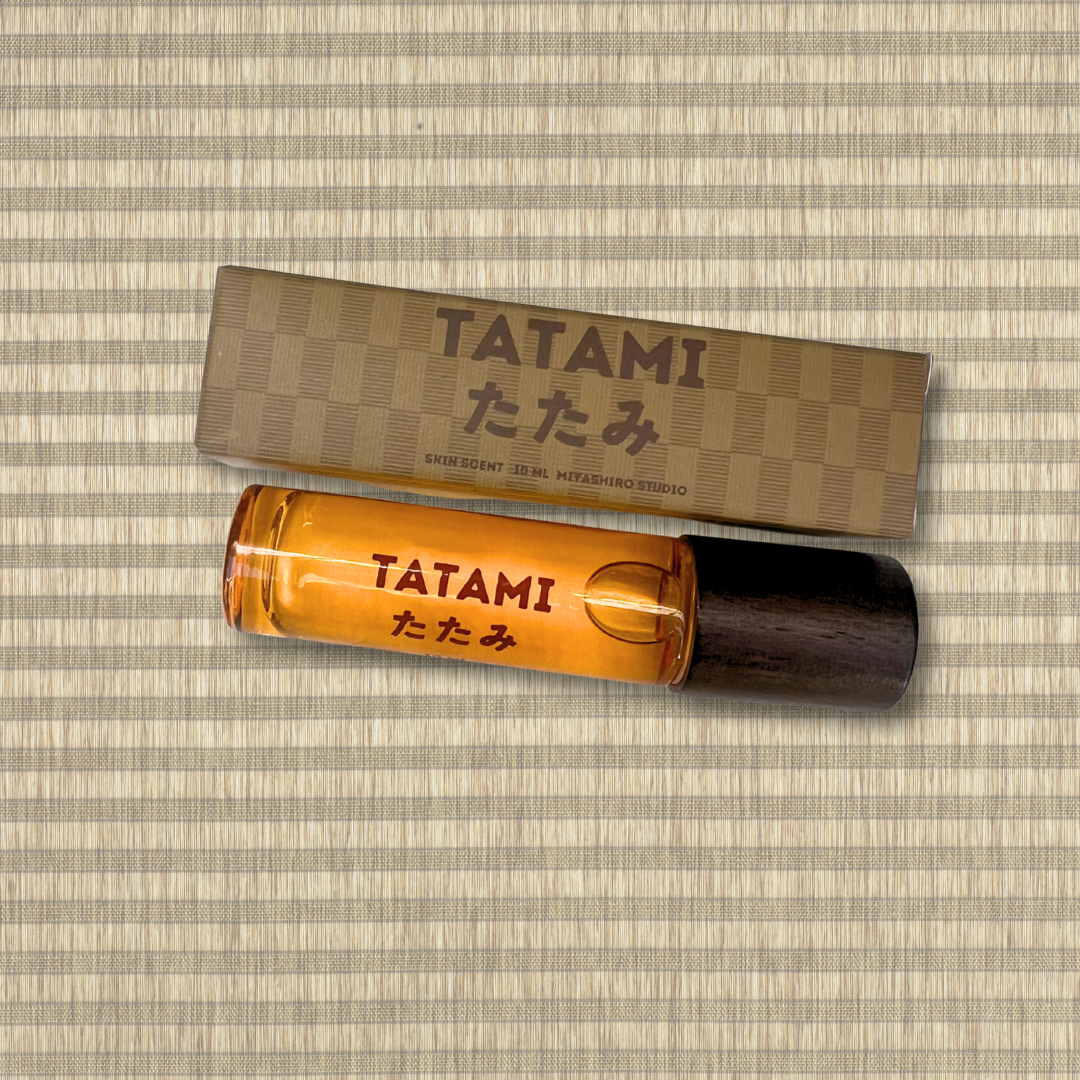 Tatami perfume bottle and packaging on a striped background