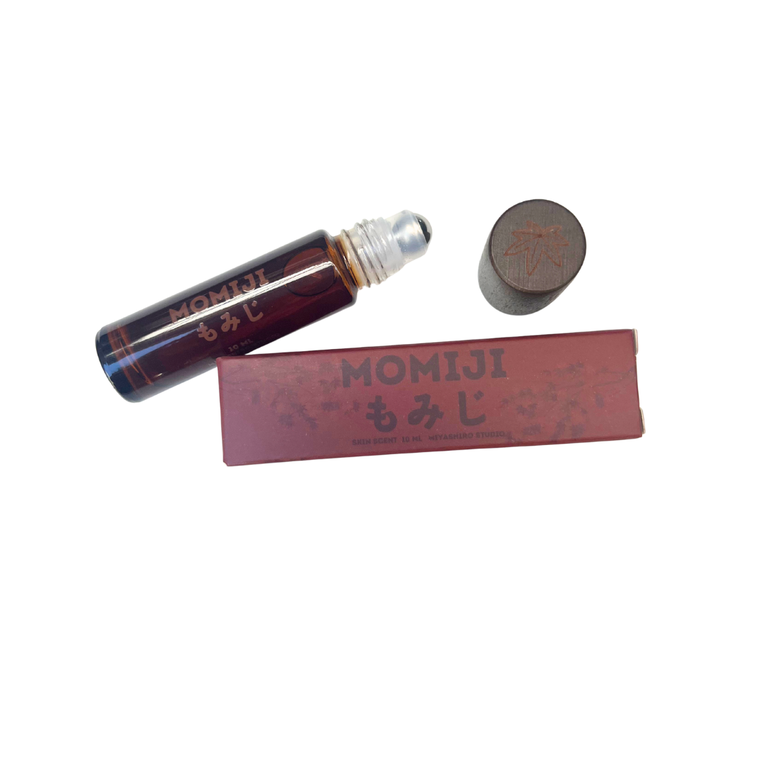 Momiji rollerball and packaging on a white background
