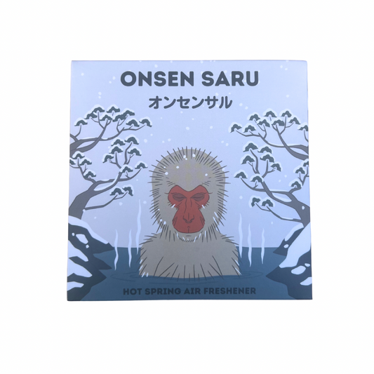 Onsen Saru hot spring air freshener packaging with monkey illustration on a light blue background