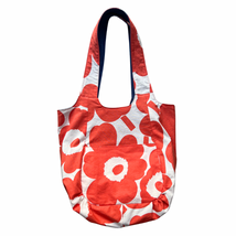 orange and white floral patterned tote bag on a white background