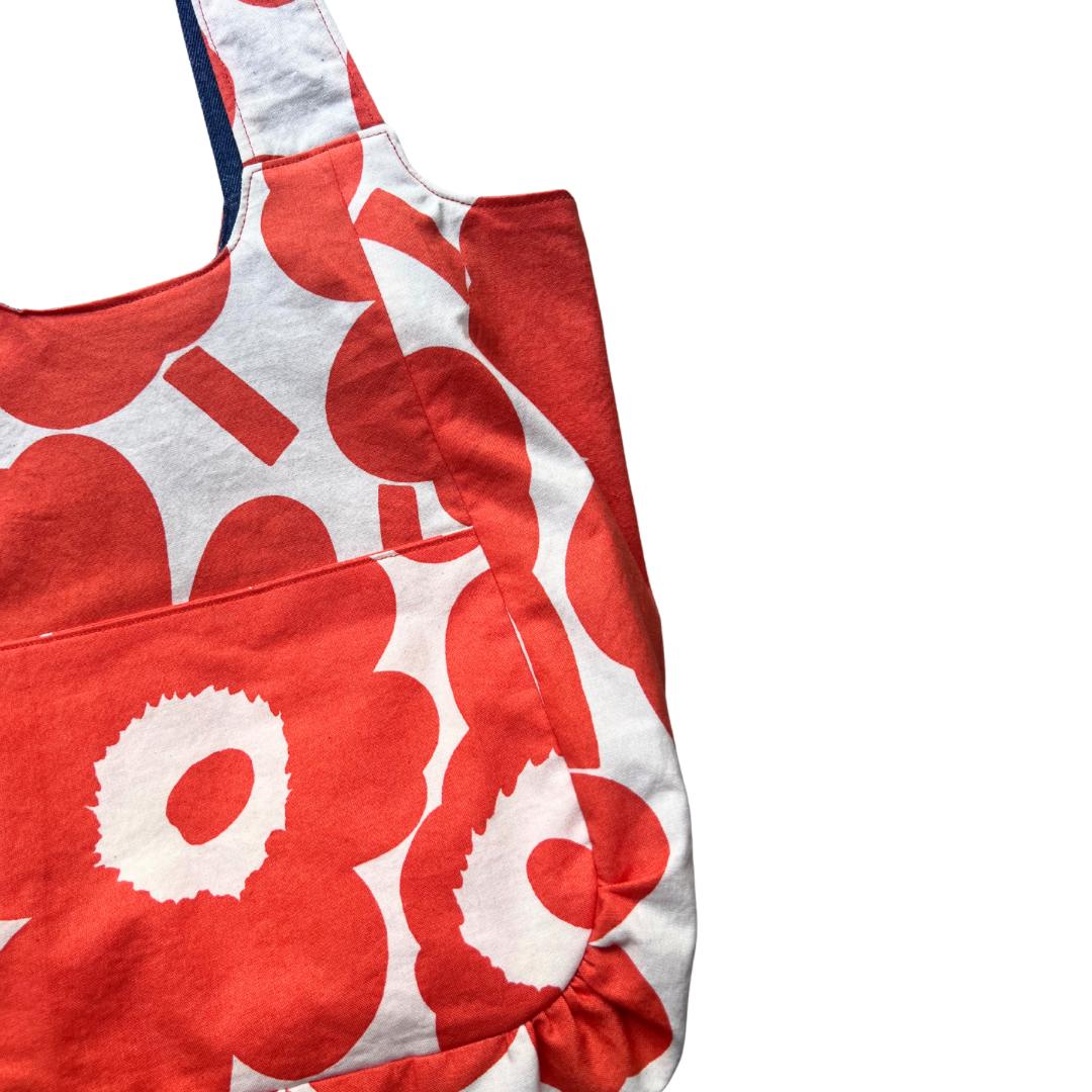 orange and white floral patterned dress on a white background