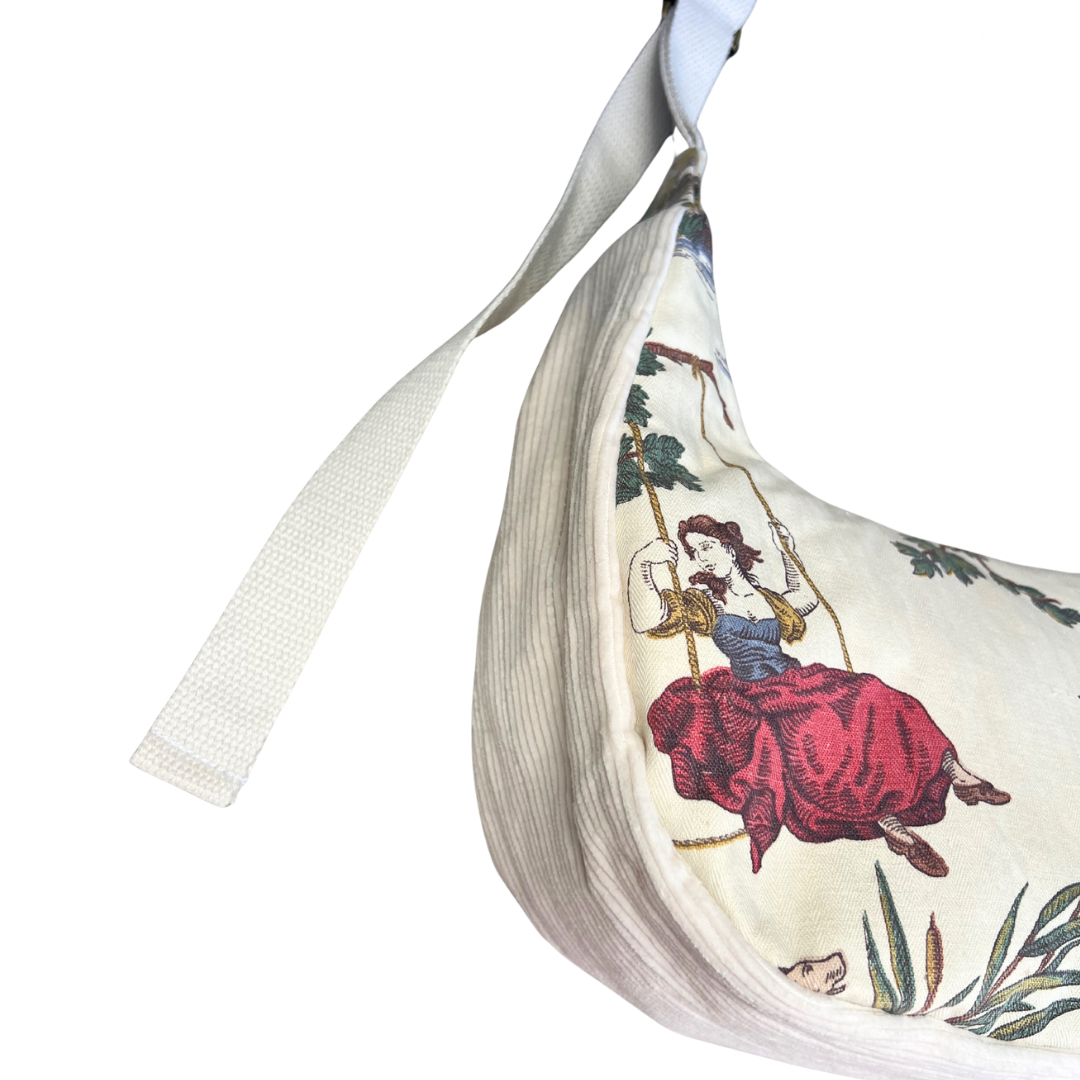 Purse printed design of a woman on a swing